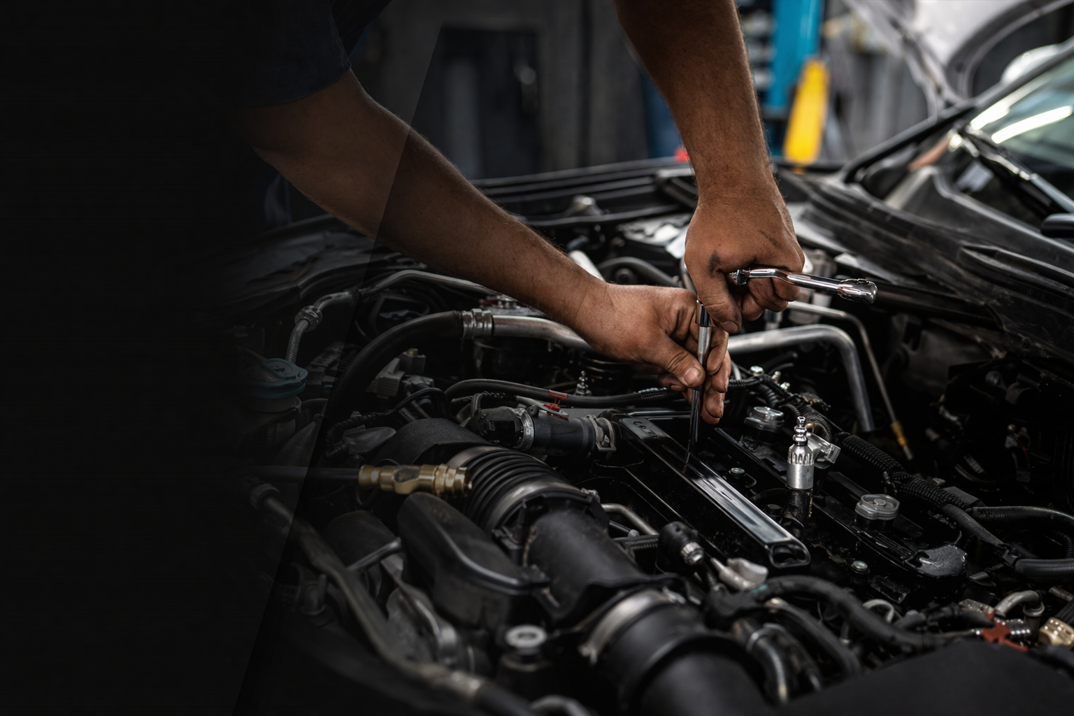 Mechanic repairing an engine at E and JR Equipment Repairs
